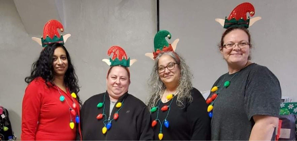 (Left to right) Shelly Goodson, Amanda Fisher, Jennifer Hawkins and Jackie Burt dressed as elves during the 2020 giving event.