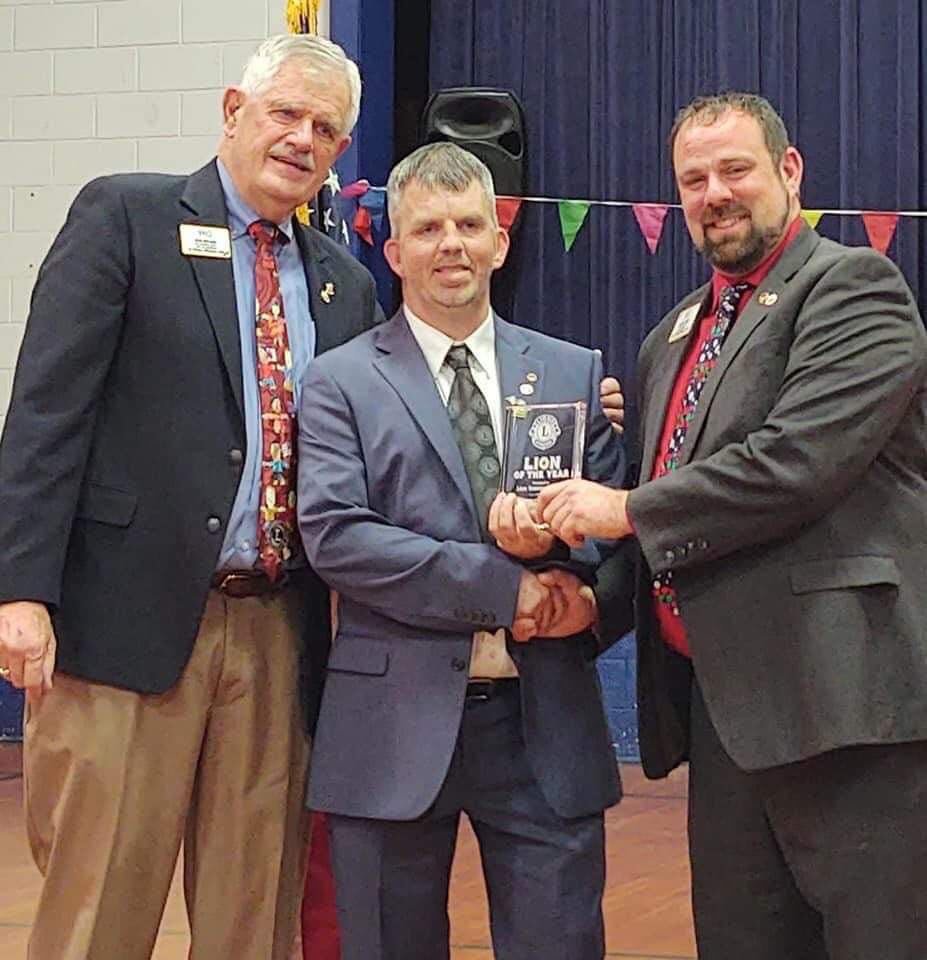(Left to right) The Past International Director, Donald Noland, Marshfield Lion Club President Tom Claxton and International Director of the Lions Club, Justin Faber present the 2021 Lion of the Year.