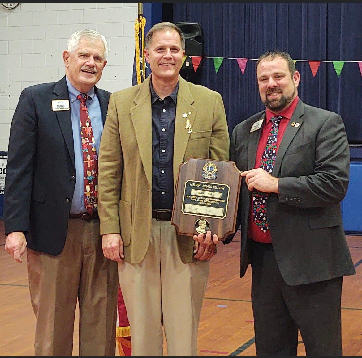Bart Tibbs is presented with the Melvin Jones Fellow award, the highest honor of the evening. Pictured left to right: Past International Lions Club Director Donald Noland, Bart Tibbs and current International Director Justin Faber.
