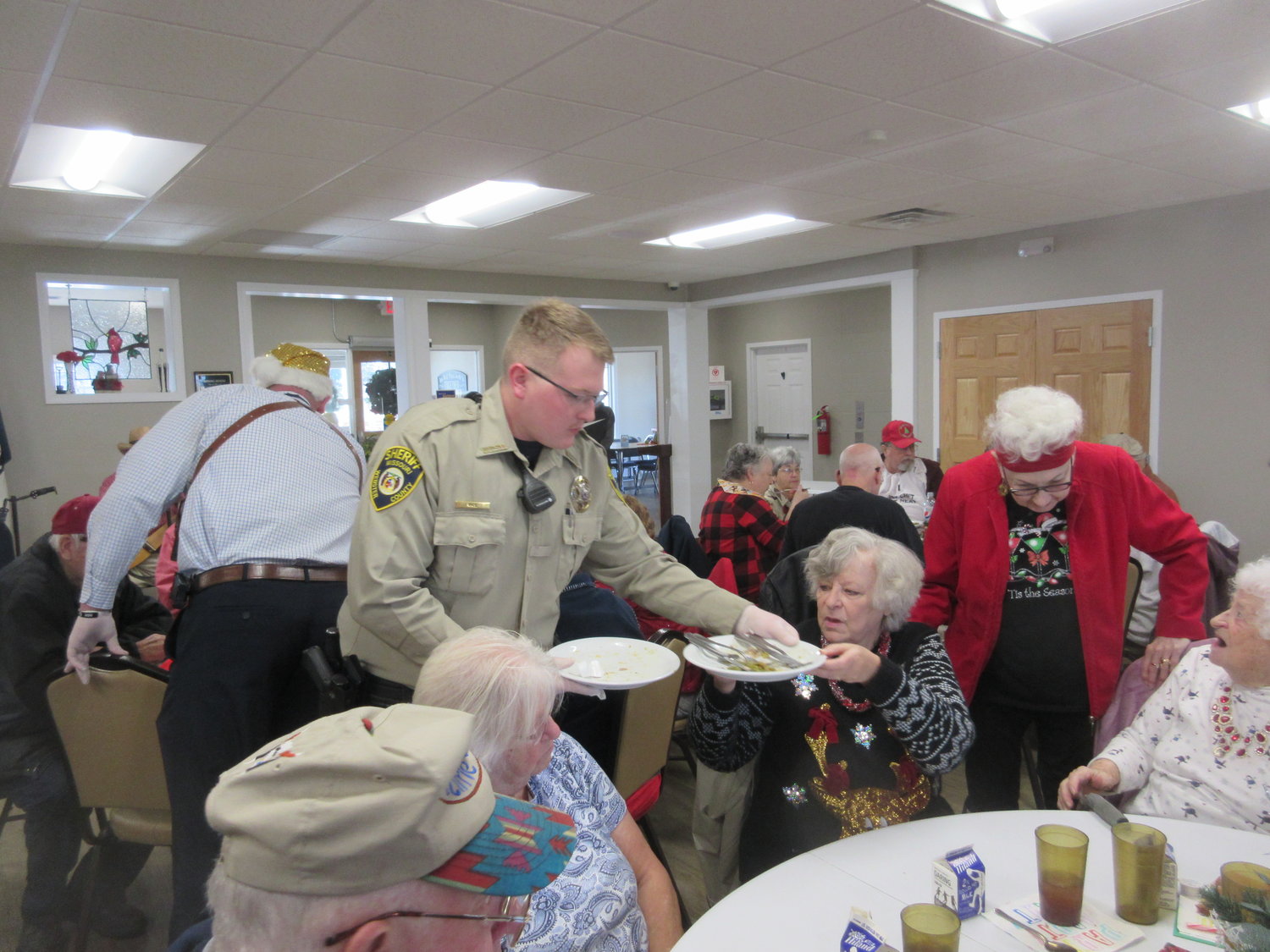 Deputy Austin Rice pictured bussing tables after the Christmas meal.