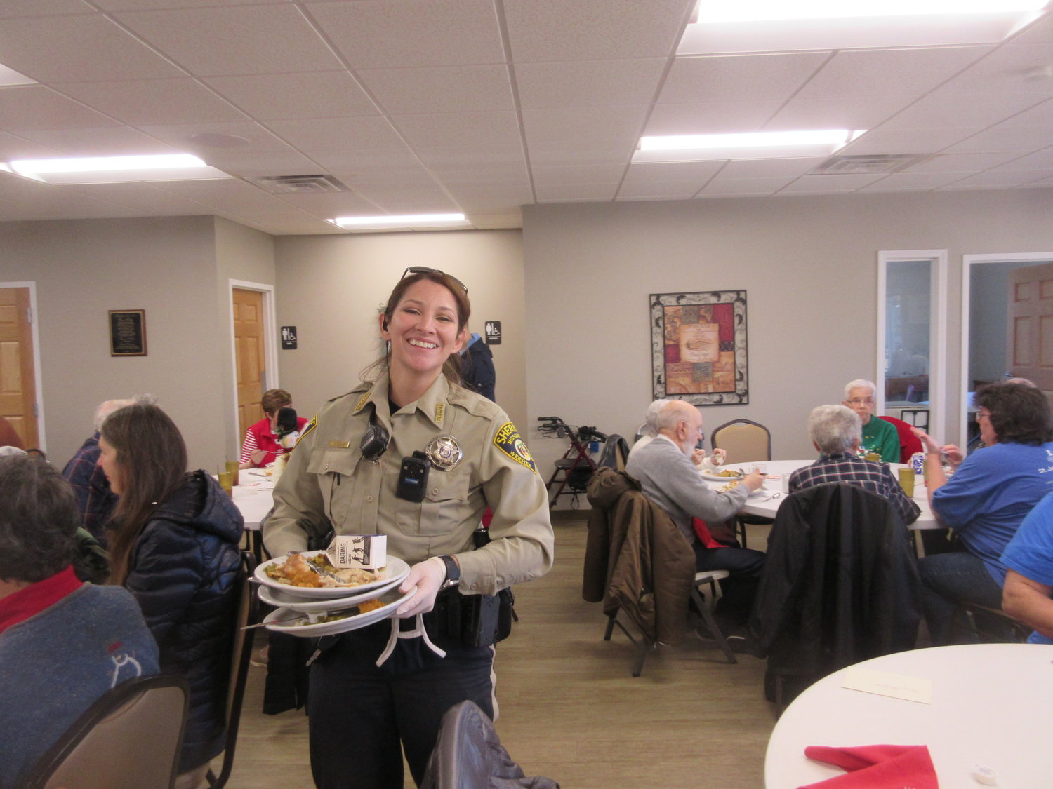 Deputy Chelsea Loveland shares a smile as she shows the true meaning of service at the Marshfield Senior Center.