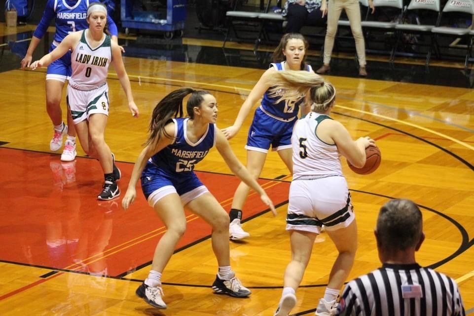Marshfield defenders go against Springfield Catholic opponent during the consolation game.