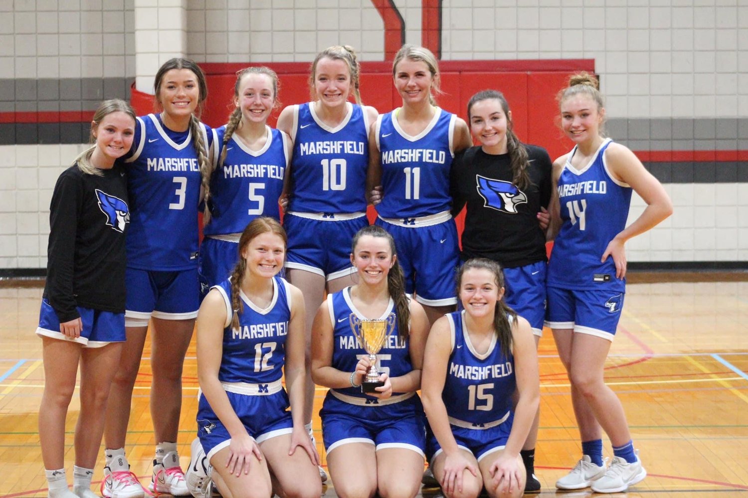 Marshfield Lady Jays with the consolation game hardware after defeating Catholic.