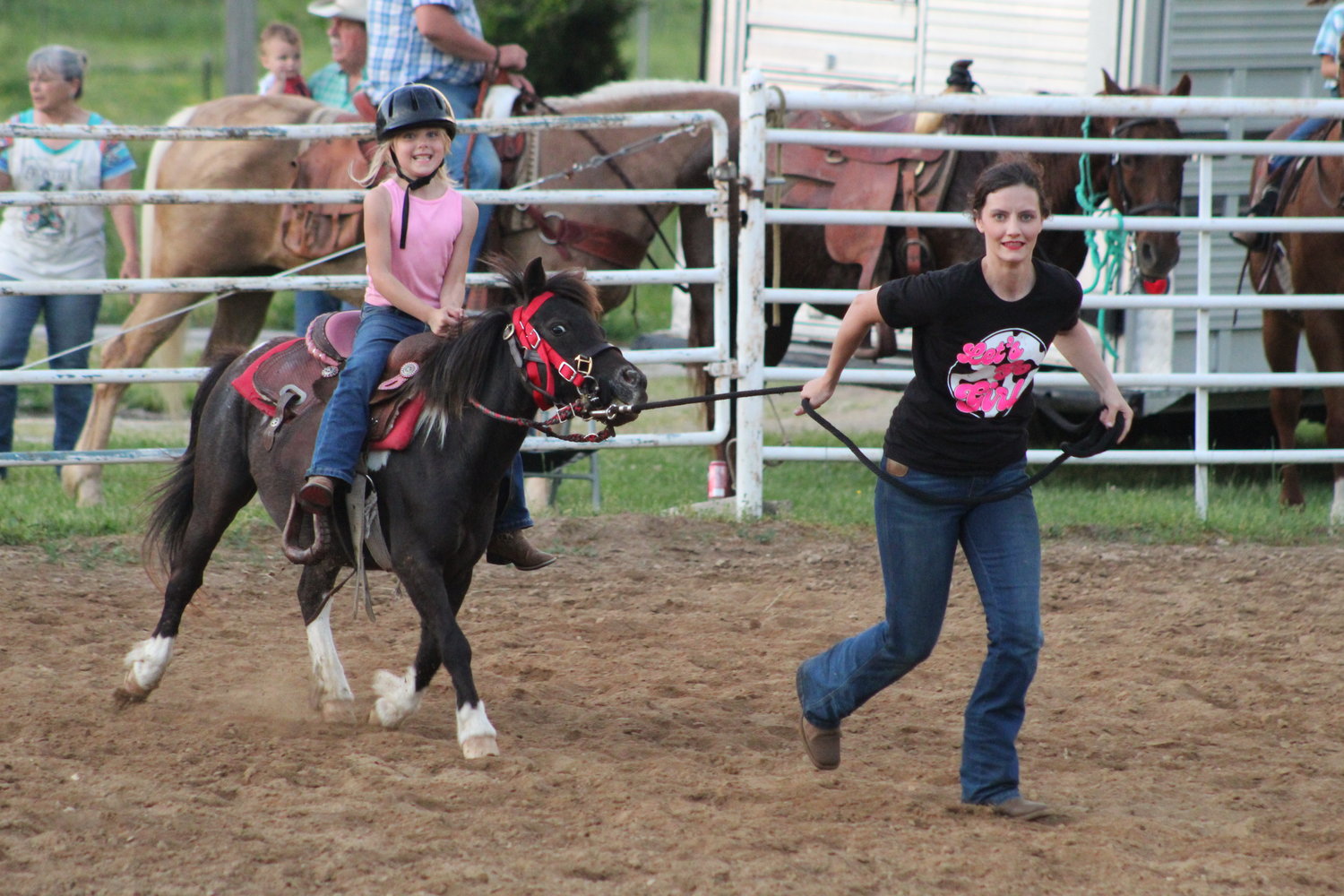 Fun in the neighhh-borhood! Brystol, Coco, and Brittney Lawless are all smile during the down and back run.
