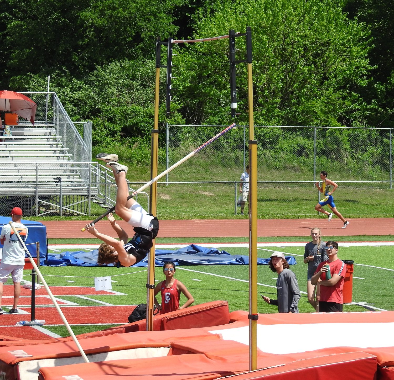 Oh SNAP! Junior Travis Greenfield’s pole snaps mid vault during his fight for 2nd place in the boy’s pole vault. Greenfield is one of 19 athletes who are headed to Waynesville to complete in Class 4 Sectional 3 Championship. Photo Contributed by David Greenfield.