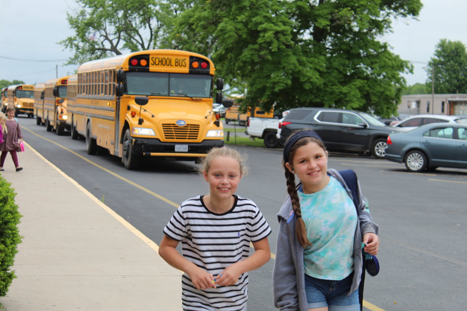 Schools out for summer! Webster Elementary students are all smiles as they hop off the bus to celebrate the last day of Marshfield schools on May 24. 
