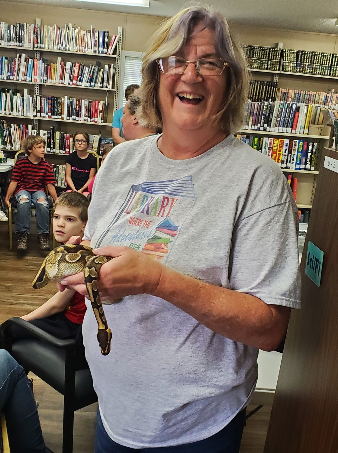 Becky Fisher, head librarian at Fordland Memorial Library holds a snake during the “snake lady” visit to the library. On the fourth Saturday of each month the Library hosts a family friendly event with guest speakers and lunch for everyone who attends.