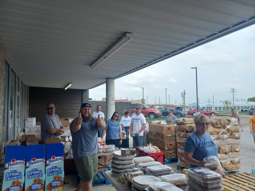 Ethan, the worship leader (giving the double thumbs up), along with other volunteers, work together to bundle food during distribution day. Distributions are the second Friday of every month from 9:00 a.m.-1:00 p.m. Wheel Fed distribution is open to anyone in Webster County who meets income guidelines (or are receiving government assistance). 