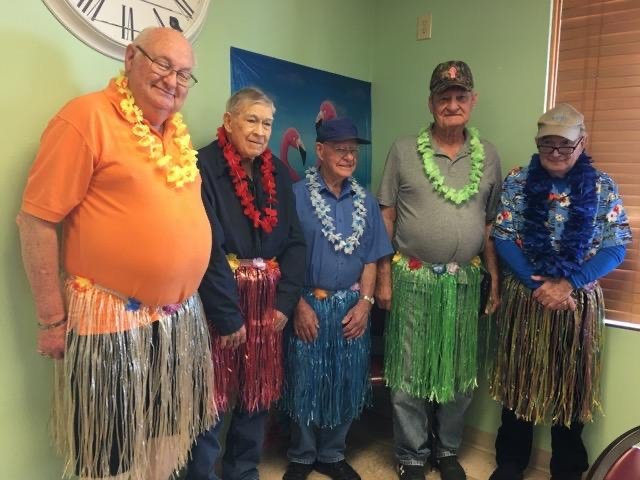 Volunteers dress up for a Hawaiian Luau at the Rogersville Senior Center.
