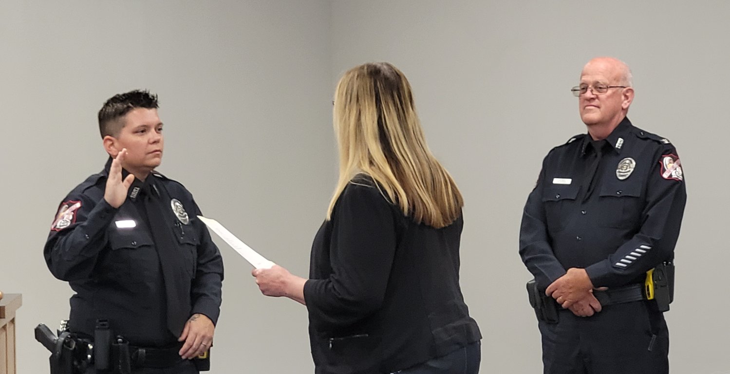 “...I will support and defend the Constitution of the United States and the Constitution of the state of Missouri, against all enemies, foreign and domestic…," repeats Officer Chandra Calhoun after City Clerk Sandy Strecker.