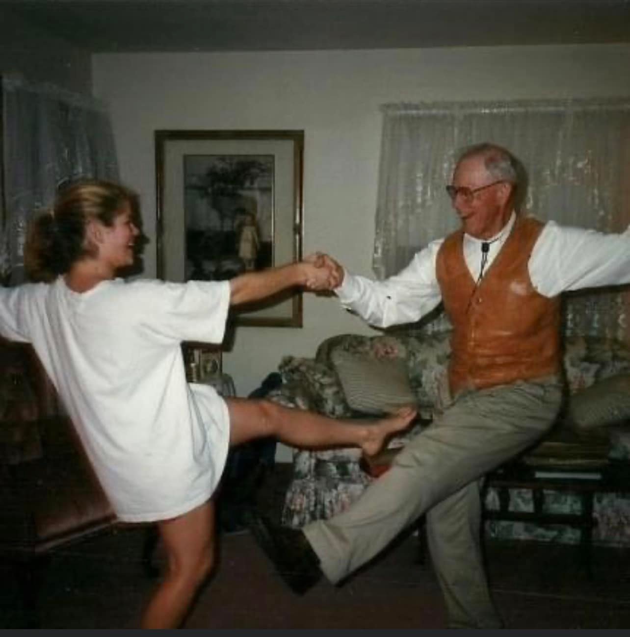 Mary Jo, or “Joey” lived with her grandparents during her final years of high school. She shared fond memories of her grandfather watching her cheer, working cattle, and waiting  patiently in the car for Joey on Sunday mornings before church. The two are pictured here  dancing in the Macdonnell’s living room. 