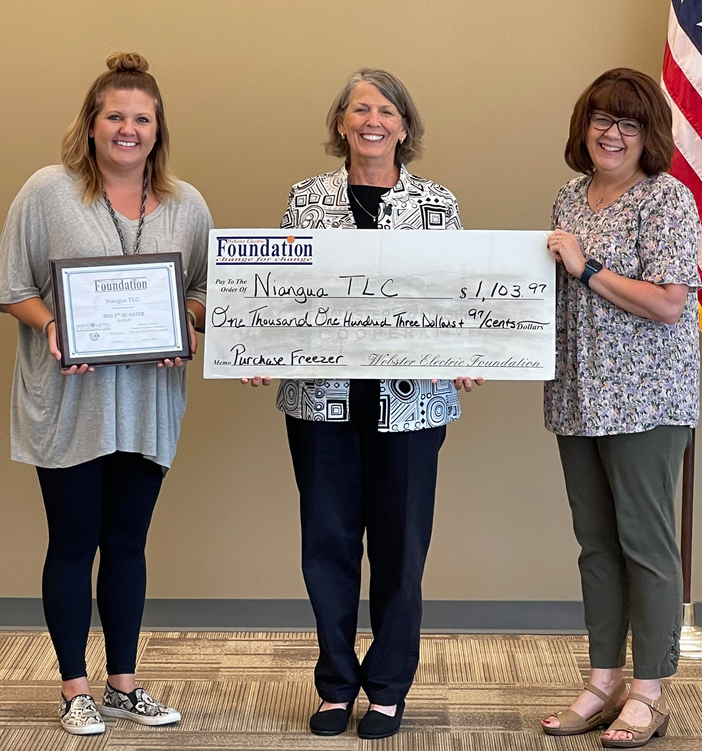 Niangua TLC members accept a grant in the amount of $1,103.97 to replace a freezer for the FACS department at Niangua Schools.