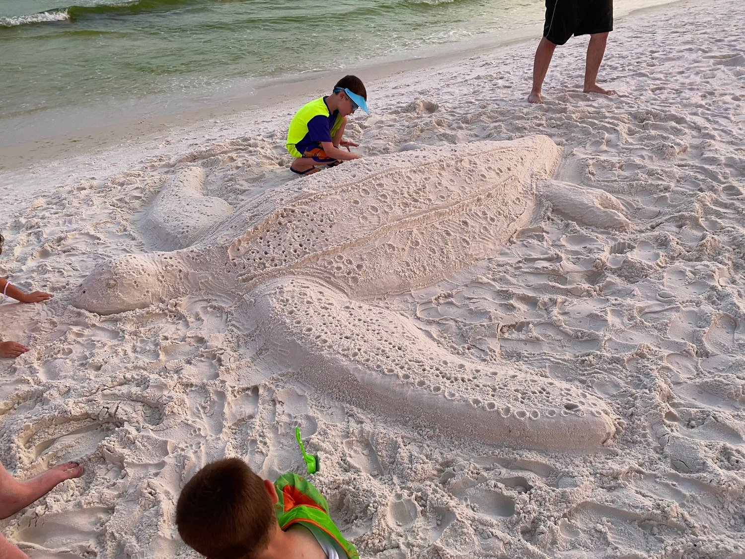 Sarah Jones and her family headed to Florida to spend time with extended family and soak up the sun. Together they made a giant sea turtle sculpture on the beach. Photo credit: Sarah Saxon Jones-Fordland.