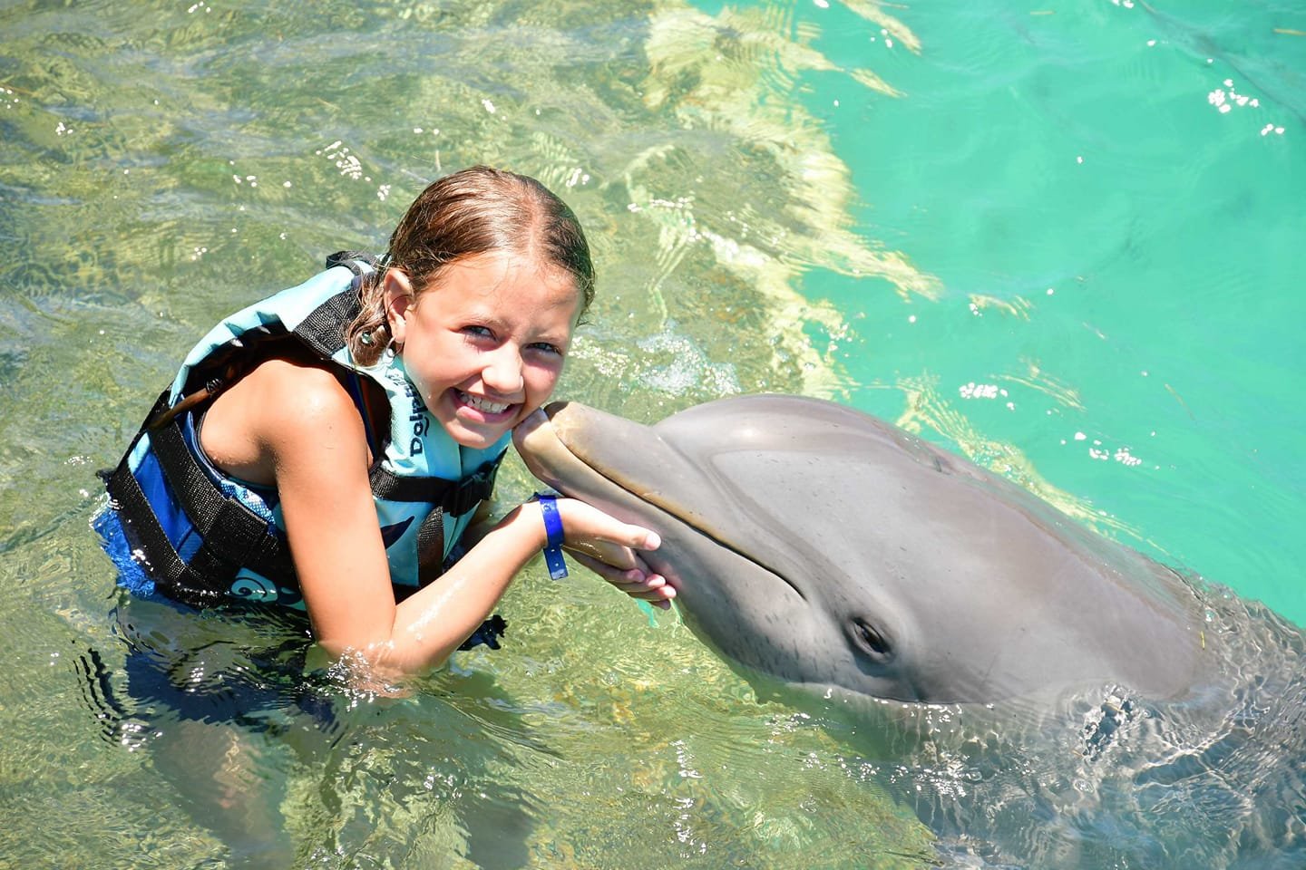 Michelle Sawyers-Ipock and her family spent a week in Isla Mujeres Mexico where they swam with dolphins.