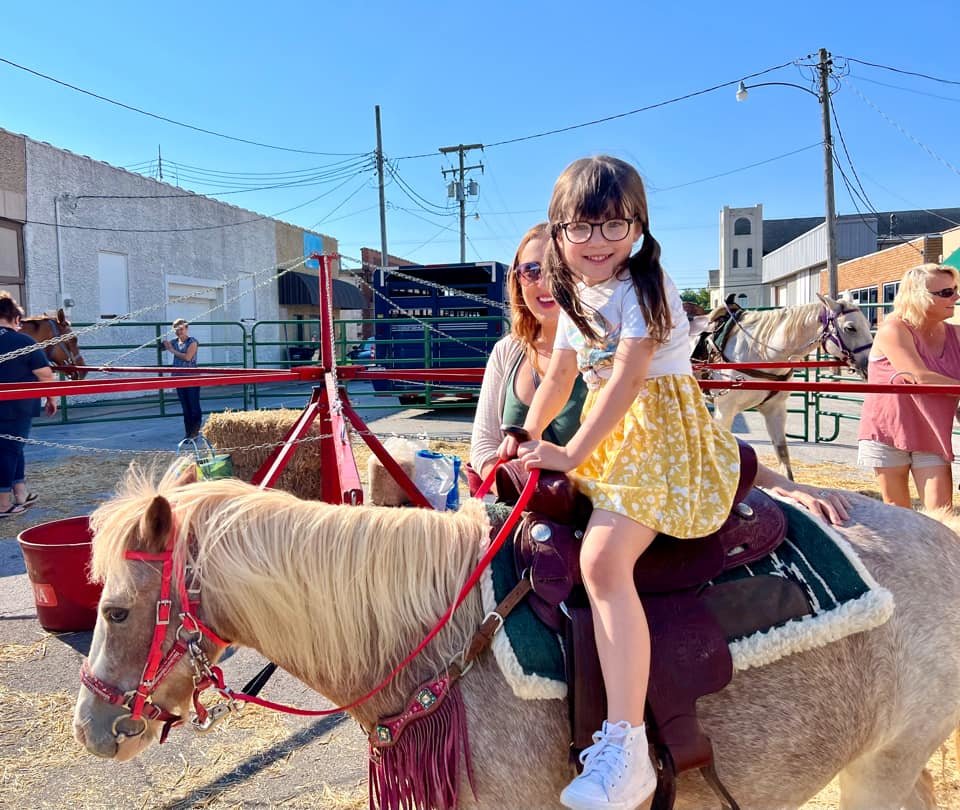 Harper, age 5, enjoys a pony ride.
