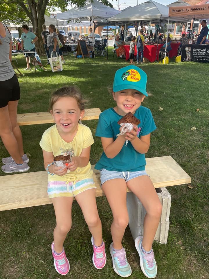 Brighton, age 7 (right) and Olivia age 4 (left) enjoy some of the many food options available at Harvest Days.