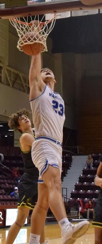 Marshfield Blue Jays senior Zack Mings sinks a basket during the Blue and Gold Tournament in the game against Parkview.