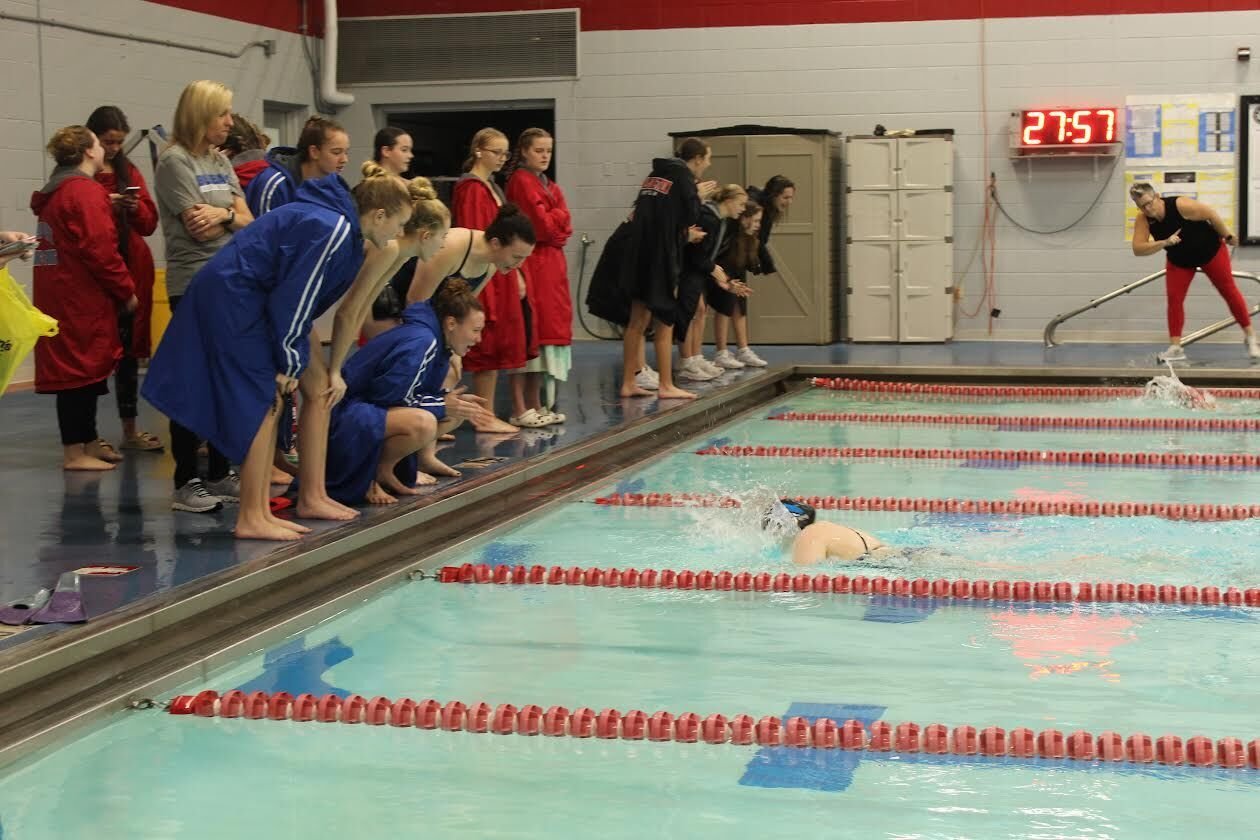 The Lady Jays swim team cheers on teammate Maggie Grace as she swims the 200 freestyle in Webb City on December 10.


“It shows how our team is-such great teammates,” shared Ann Leonard, Head Coach of the Girls Swim Team.