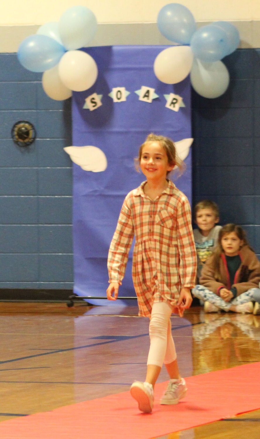 2nd Grader Reece Robertson walks down the red carpet accepting her Soaring BlueJay Award.


Mail Photos by John "J.T." Jones