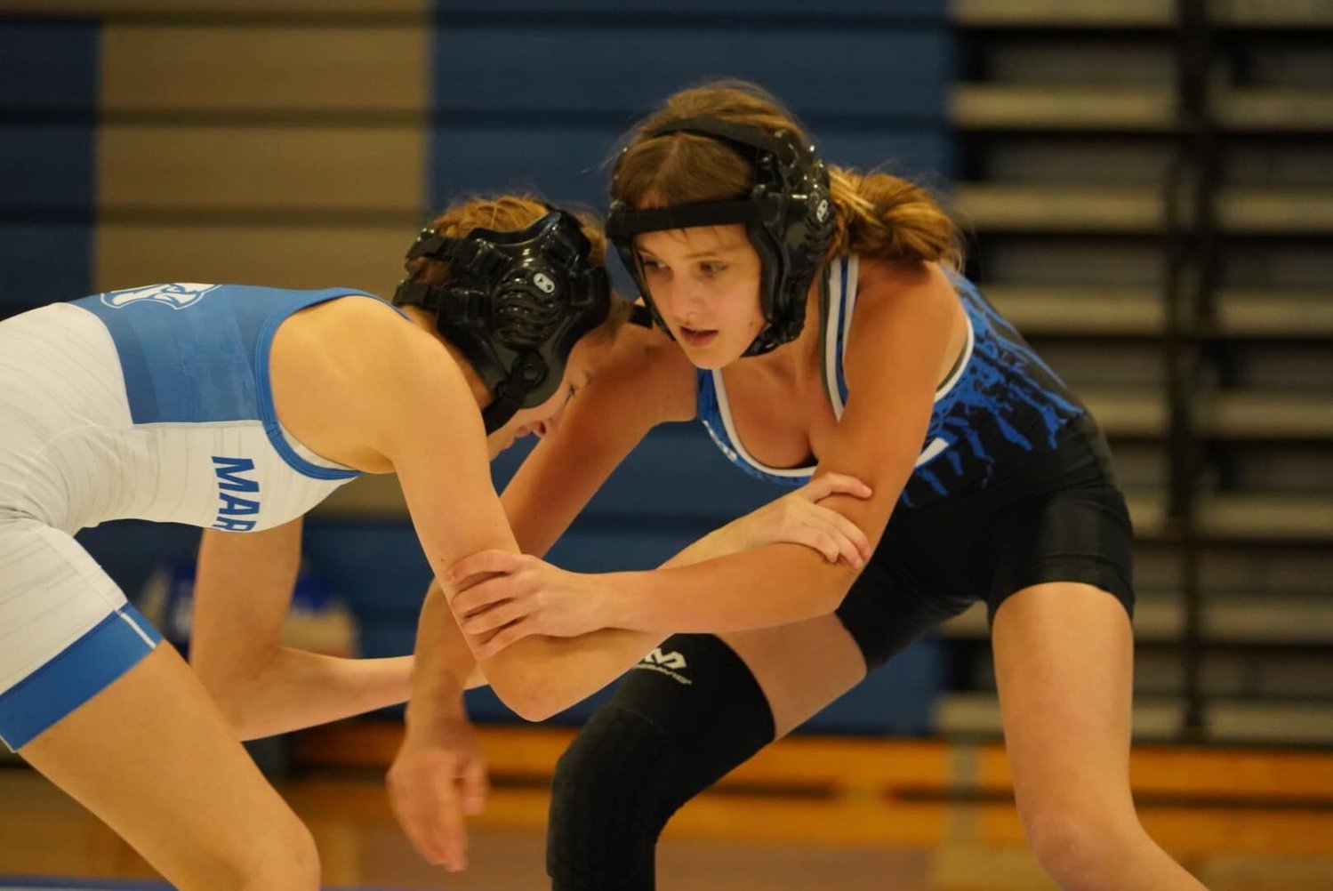 “Our first dual competition will be at Ozark on November 29 against two very competitive teams in Ozark and Cassville,” shared girls head coach Adam Wright. “We are a young team with only one senior but we have a lot of talent. I am excited to see how our younger girls compete and see how far our experienced wrestlers have progressed since last season.” In white: Sophomore Bianca Dockery. In blue: Freshman Bayleigh Cruise.