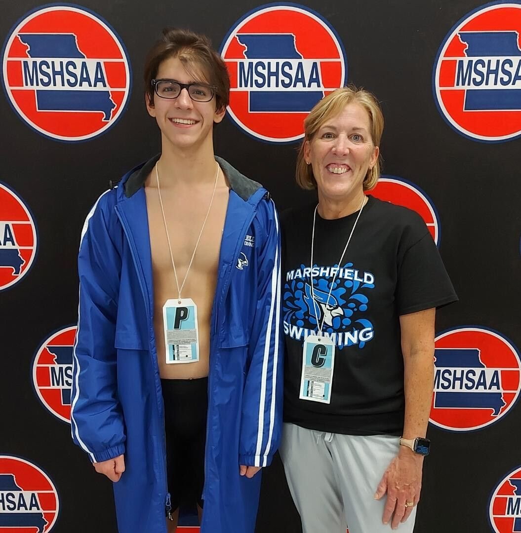 Dotson poses for a picture with swim coach Ann Leonard after competing at the state competition.