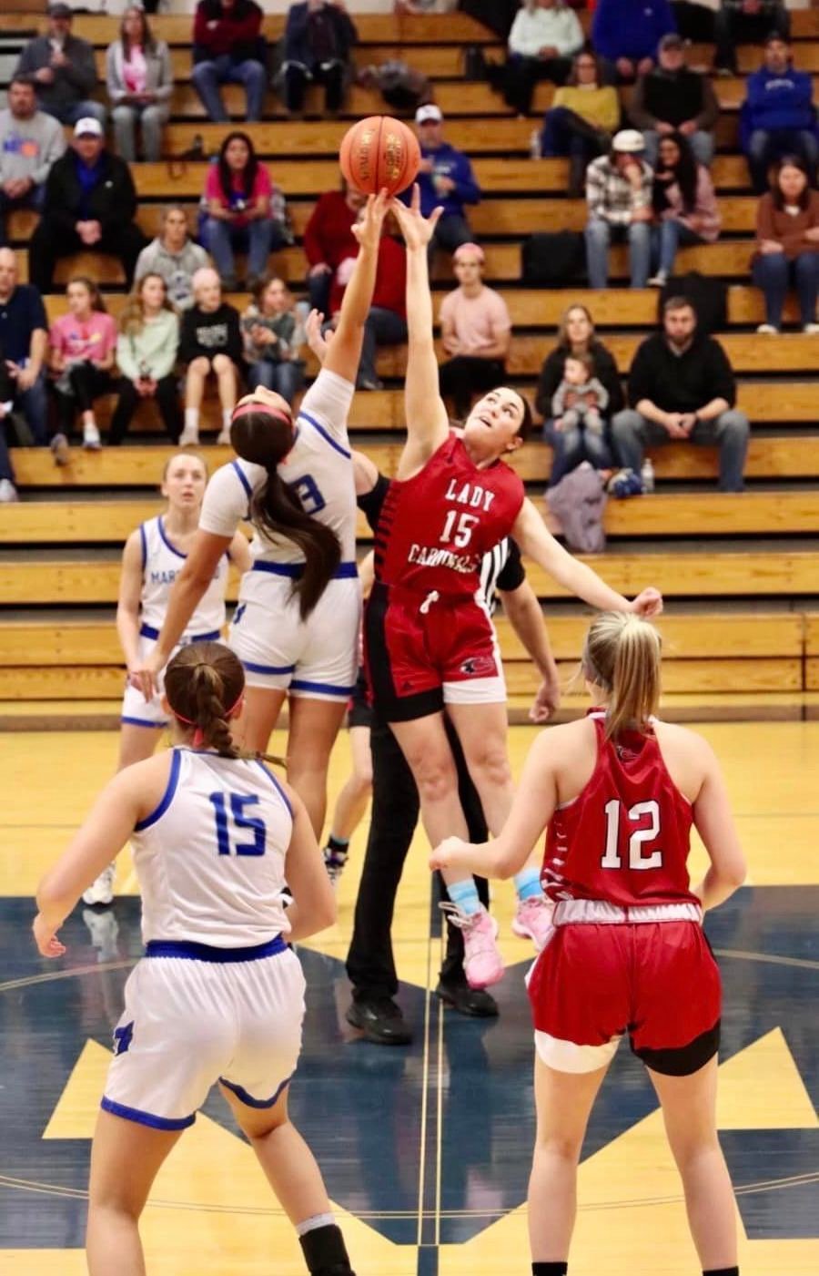 The opening jump for against the Chadwick Cardinals is Freshman Chloe Bateman.


Photos by Julie Manary