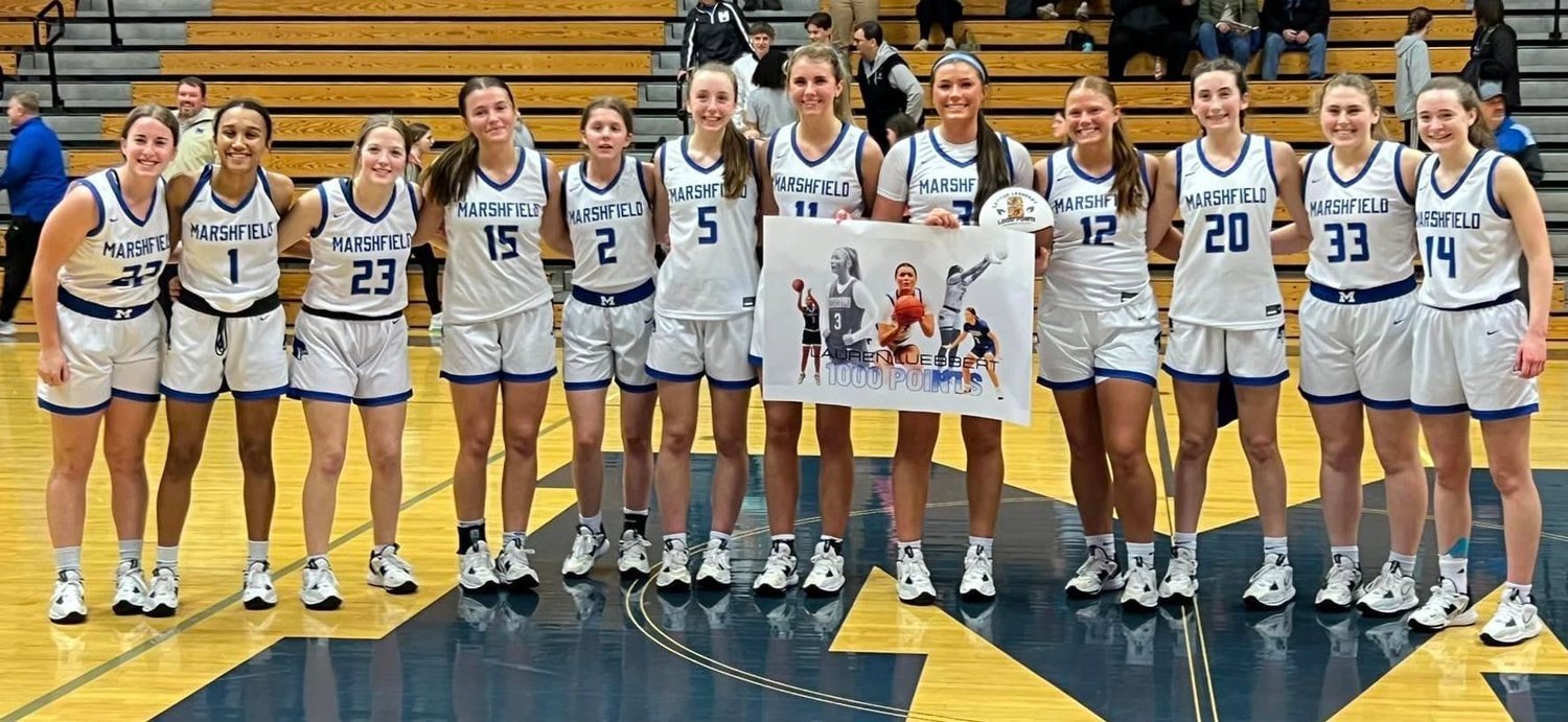 Pictured here smiling with her team after making over 1000 points in her high school basketball career is Junior Lauren Luebbert after Friday night's game against Mansfield.


Contributed Photo by Julie Miller Manary.