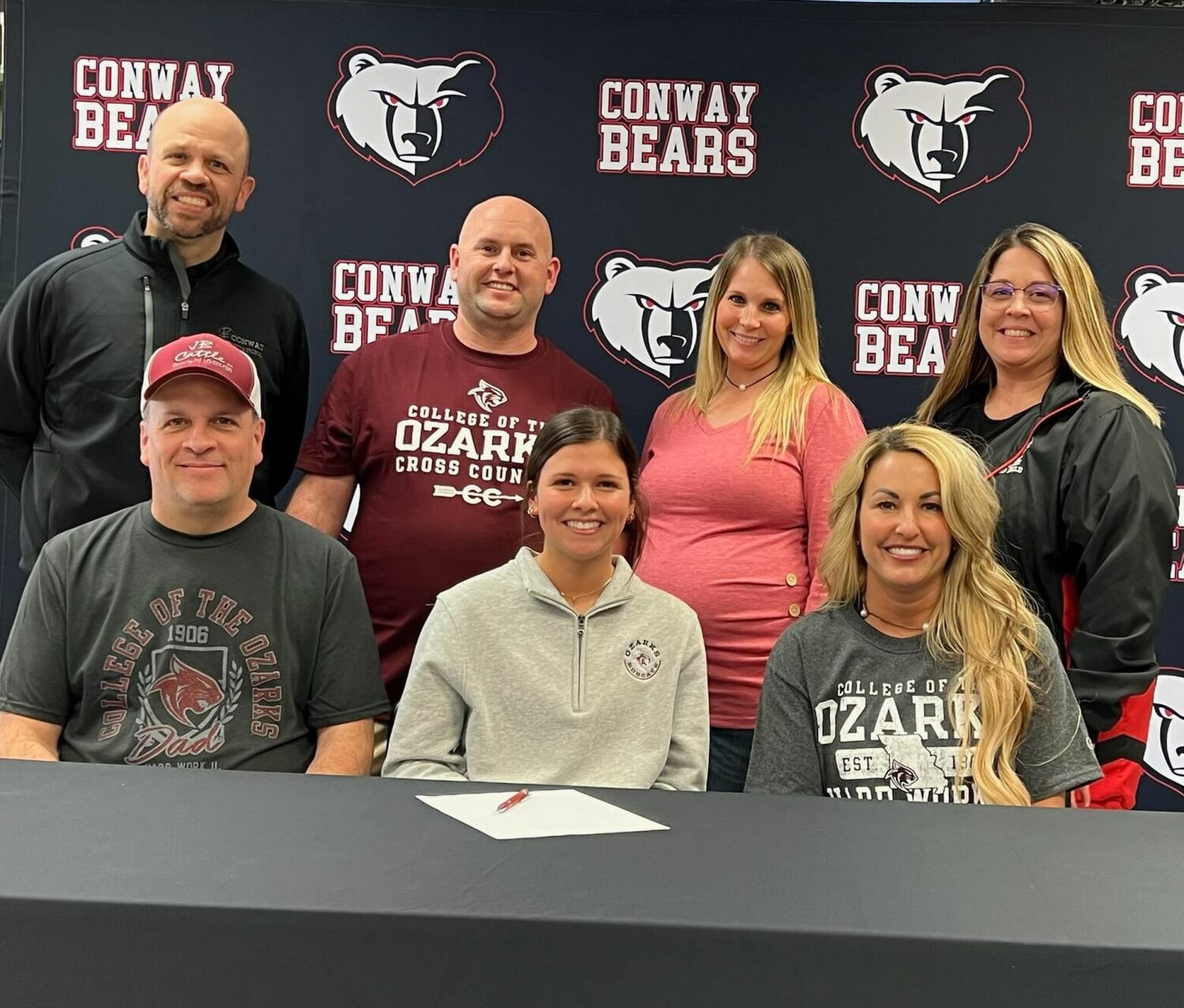 Gracie Vestal is pictured alongside her family after signing her letter of intent to run cross country at College of the Ozarks.