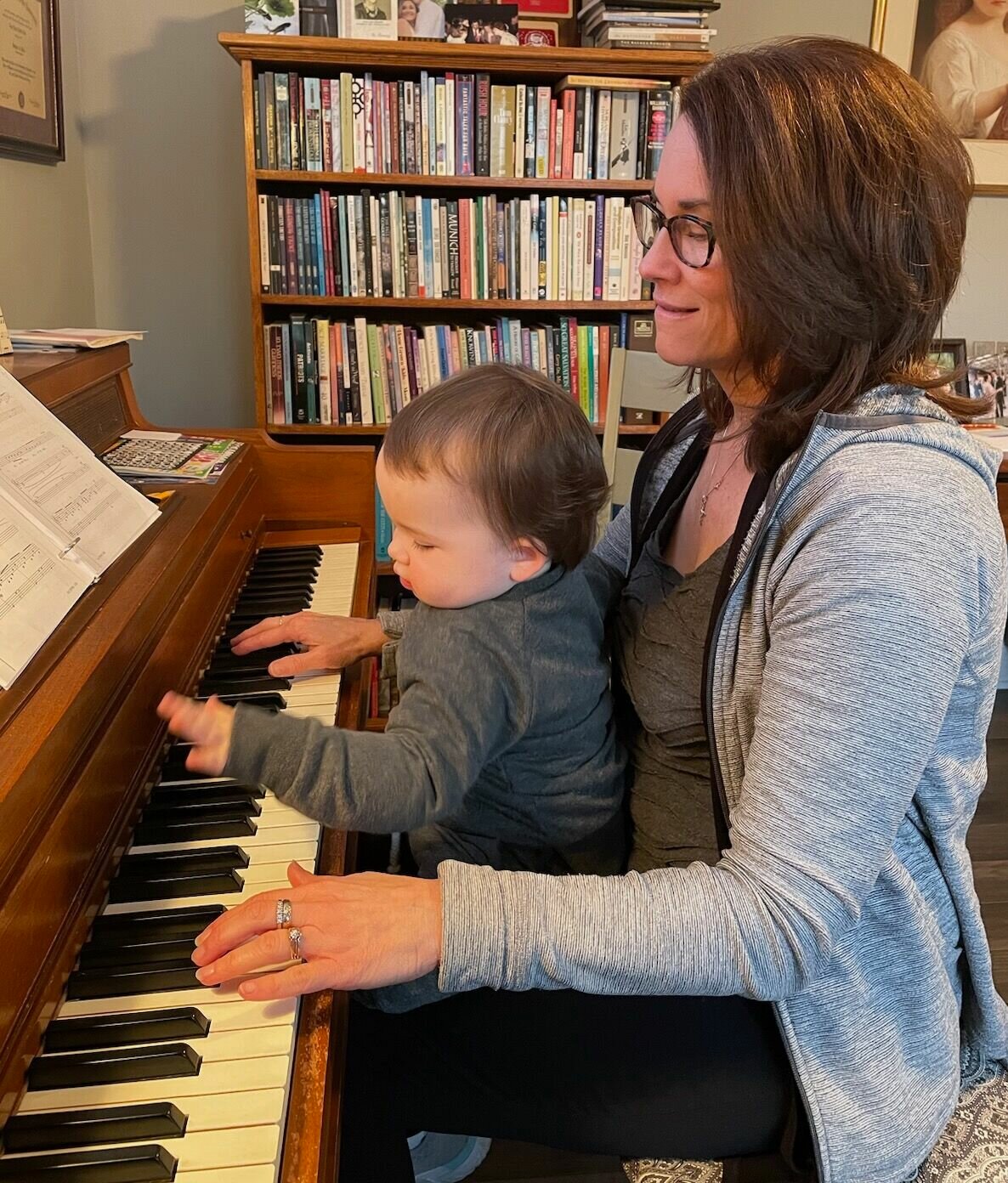 Teaching the next generation the wonder of music no matter the age. Kirk is pictured here with her grandson as he plays on the piano.