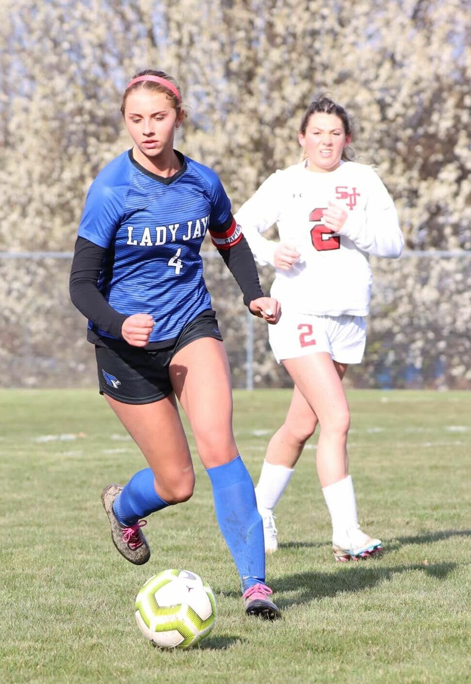 Senior Riley Manary, pictured running downfield, scored a goal for the Blue Jays, helping them win against St. James with a final score of 8-0.
