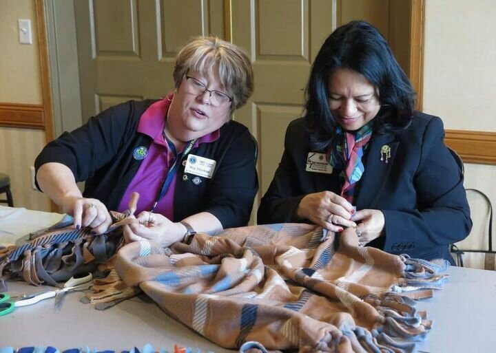 International Director Deb Weaverling (right) at 5M2 Convention making blankets with a fellow Lion. Missouri Lions District 6 will host Weaverling at its upcoming convention.