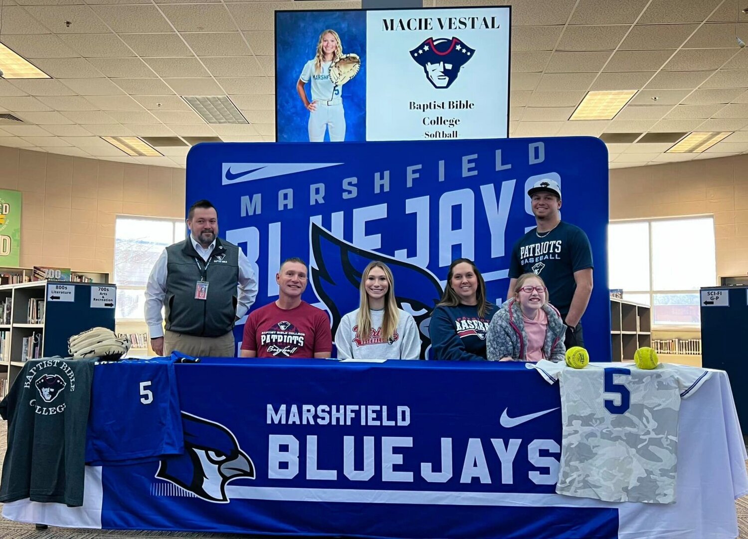 Macie Vestal is pictured with her family after she signed her letter to play softball at Baptist Bible College. 