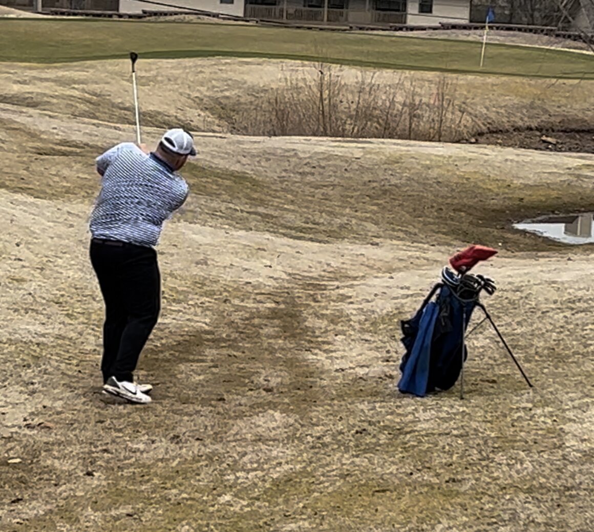 Senior Daniel Minton from Marshfield is pictured just as he swings during last week's golf tournament at Pointe Royale.