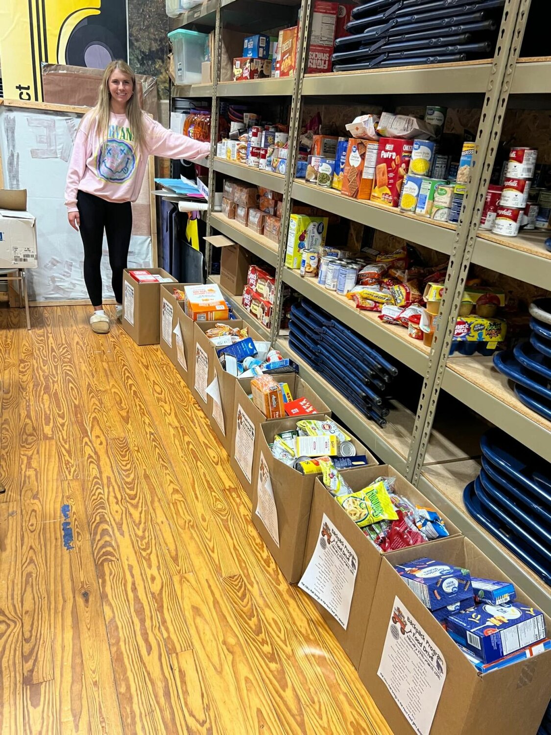 "At a young age I remember helping my mom pack the backpacks that would go out every Friday." Manary recalled as she spent some of her Spring Break this year sorting and putting away all the items the students of Webster and Shook donated for her senior project food drive.