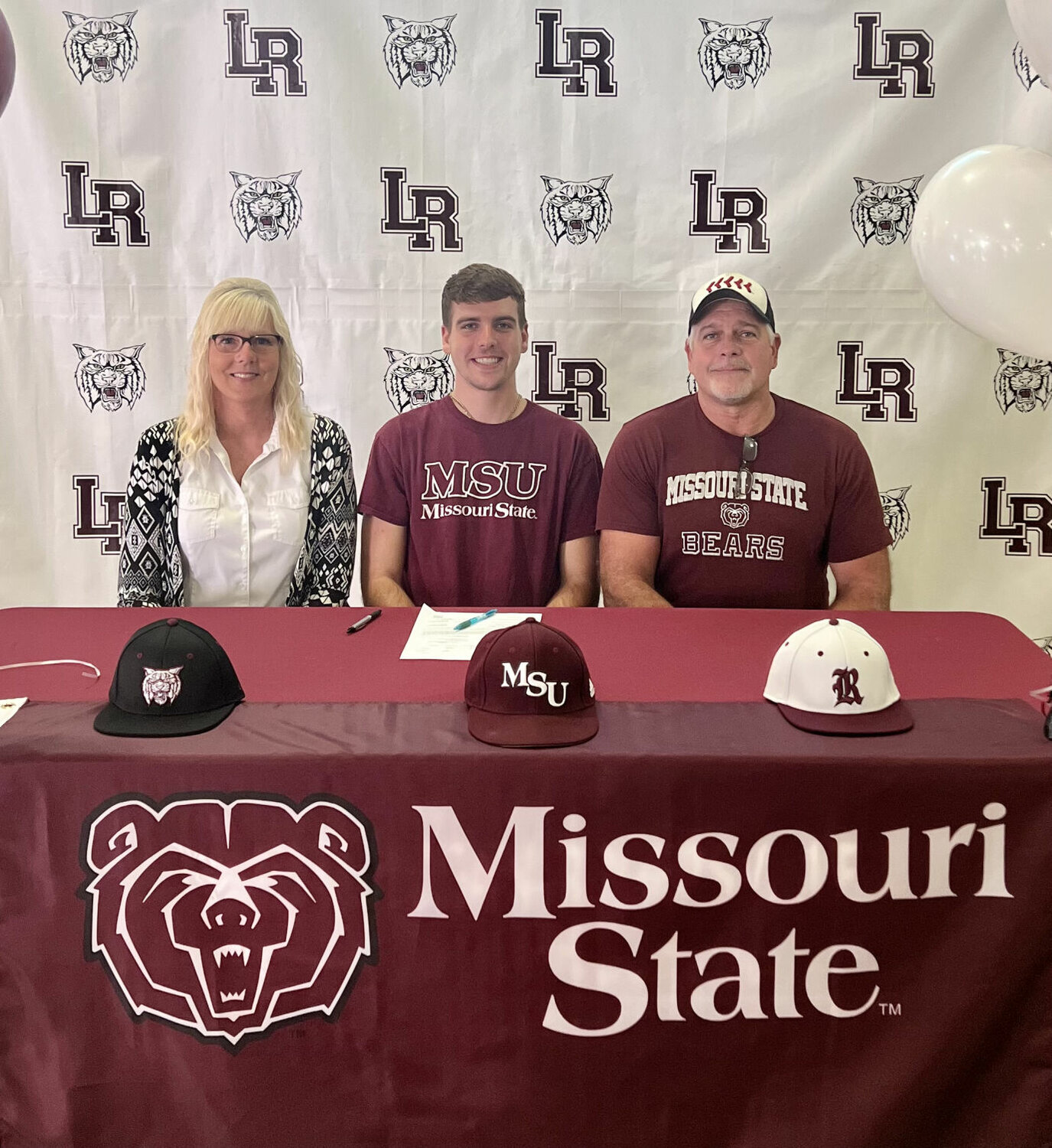 After signing his letter of intent to play Baseball at Missouri State, Brody McNiel is smiling with excitement alongside his family.
