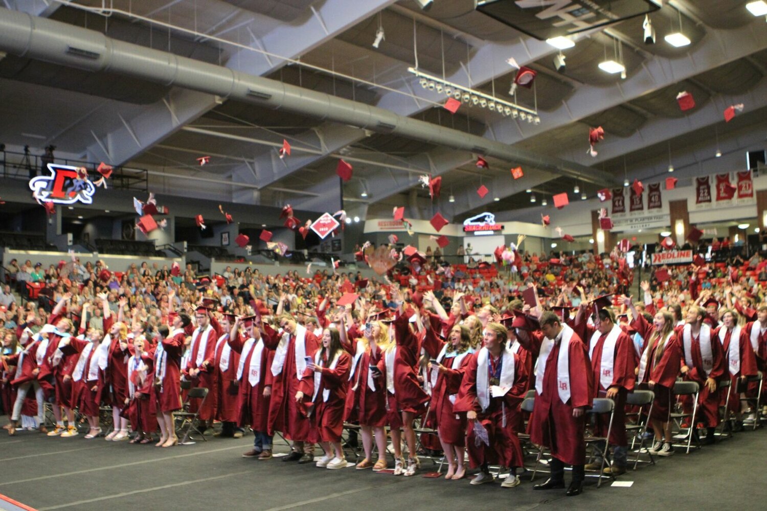 Wildcat graduates celebrate with the tossing of their caps during the 2023 commencement ceremony on the campus of Drury University in Springfield. 