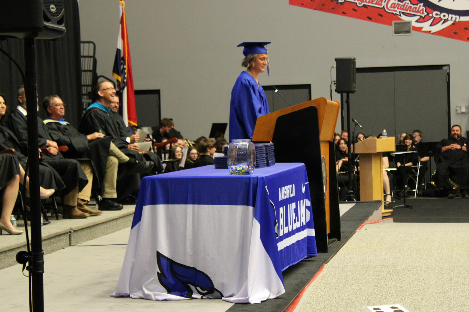 Addressing her class one last time is student body president Macie James. Shortly after, her class gave Principal Curley all the marbles he had lost over the years.