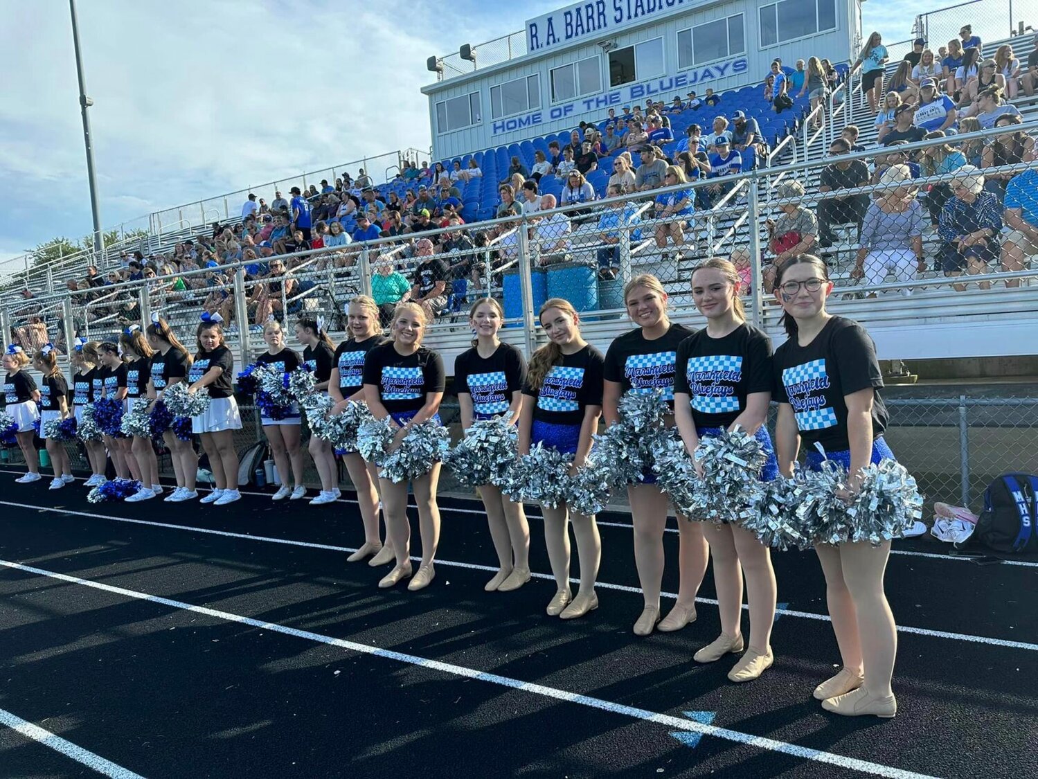 The Bluejays Cheer Team in front of fans at R.A. Barr. 