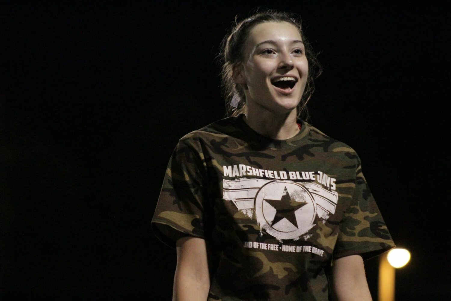 Brilynn Joyce, junior, shows off the T-shirts worn by the Bluejay Cheerleading Squad on Friday during Military Appreciation Night. 


Contributed photos