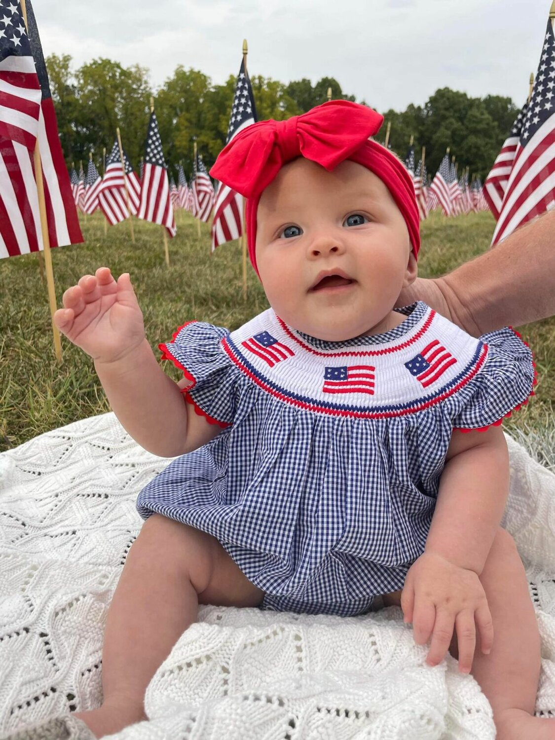 4 month old Blayke Owens is pictured in front of the 2,977 flags representing the lives lost 22 years ago.


Contributed photo