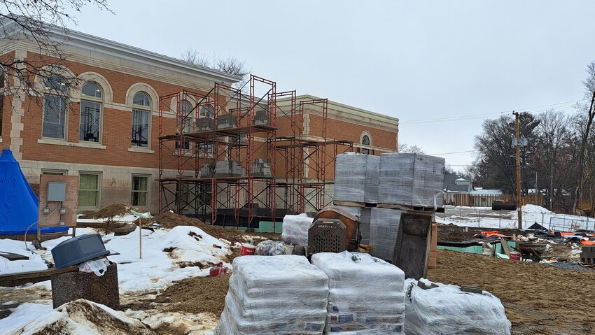 The new addition for the Sparta Free Library is going up on the eastern side of the building. The new elevator will be located where the scaffolding is located in this photo. Currently, the conditions are very muddy, but Director, Michelle Tryggestad says that rain is better than frigid temperatures, for the continuation of the expansive project.