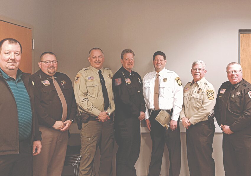 Pictured above, from the left, are WCMEG Coordinator – Investigator Rob Walensky, Jackson County Sheriff – Duane Waldera, Trempealeau County Sheriff – Brett Semingson, Crawford County Sheriff – Dale McCullick, La Crosse County Sheriff – John Siegel, Monroe County Sheriff – Wes Revels, and Vernon County Sheriff – Roy Torgerson. Together, the sheriffs make up the WCMEG Board of Directors. They have strength in numbers and funding, allowing for stronger and more aggressive actions against the criminal activities of the evil elements that seek to destroy communities and obliterate families. Herald photo by Benny Mailman.