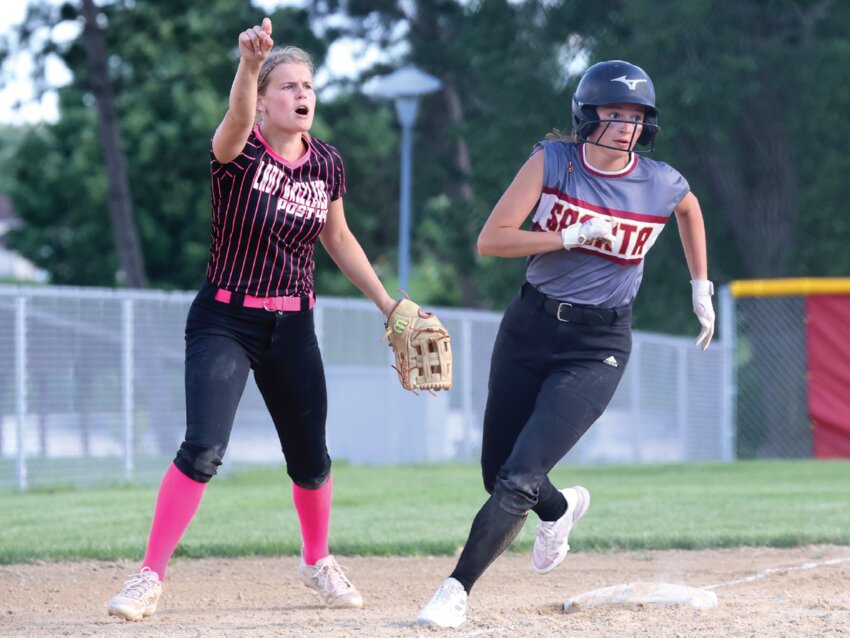 Sparta’s Lily Seifert rounds third, eyeing to score during the second inning of Wednesday’s game with Kickapoo. Seifert would score on the next play as Post 100 took a 5-0 lead early on.
