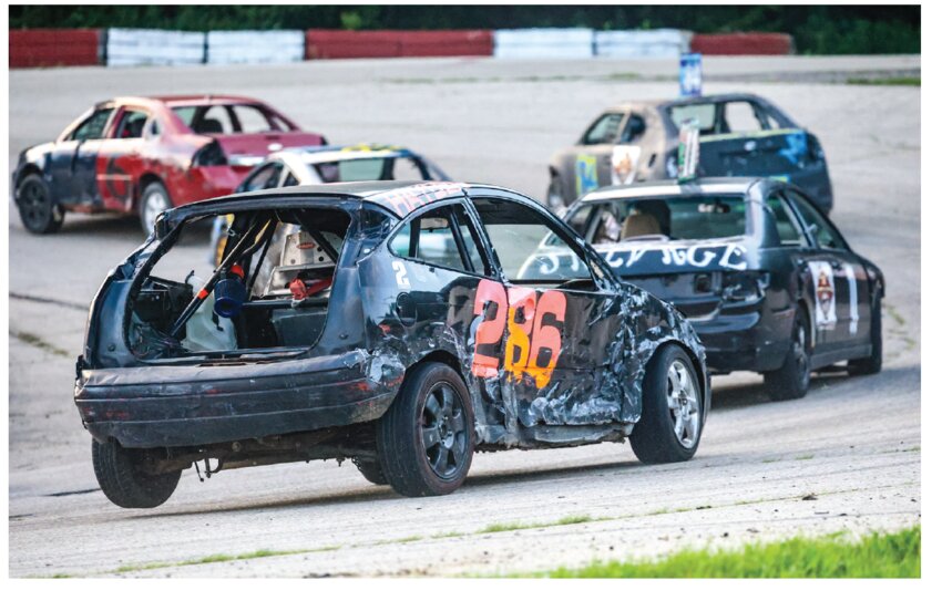 Adam Hayden (286) overtakes the first turn during last week&rsquo;s 200 lap Summer Sizzle Enduro race at the Tomah/Sparta Speedway. Hayden claimed the lead after 30 laps and went on to capture the win by completing the race just a lap ahead of second and third place.