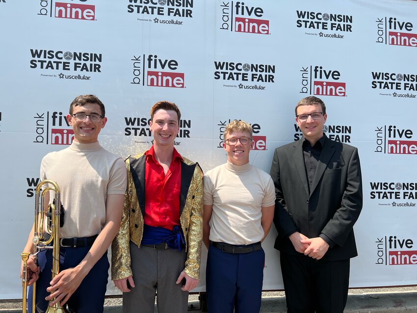 The four gentlemen from Monroe County that are a part of the 56th Edition of the Kids from Wisconsin are pictured after a performance at the Wisconsin State Fair. From left to right we have Aiden Santiago, trombone; Isaac Larson, singer/dancer; Daniel Gordon, percussion; and Alex Knoepker, Kids from Wisconsin Conductor and Tomah High School Band Director.