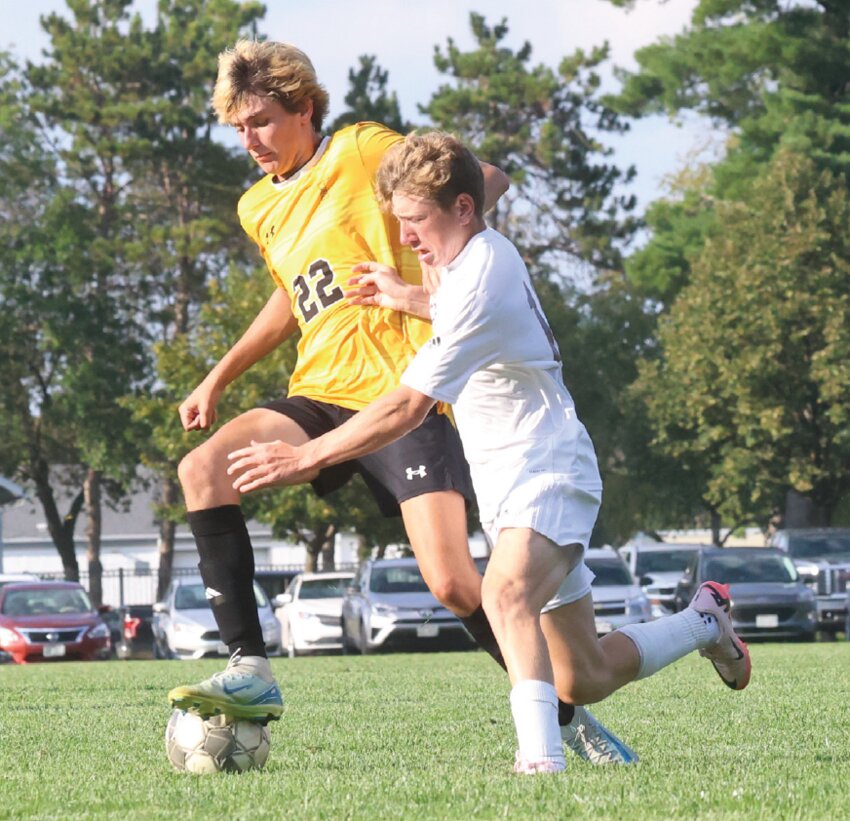 Tomah’s Jarrett Markham plucks the ball away from Holmen’s Brock Needham during the second half of Thursday’s MVC meeting. Holmen won 4-0.