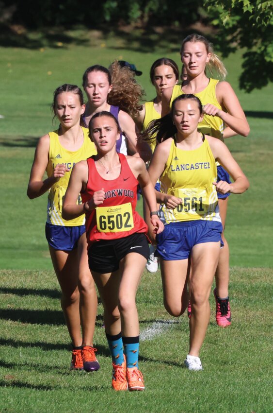 Brookwood’s Sami Markee leads a pack of runners towards the first mile marker during Thursday’s invite at Prairie du Chien. Markee finished ninth overall.