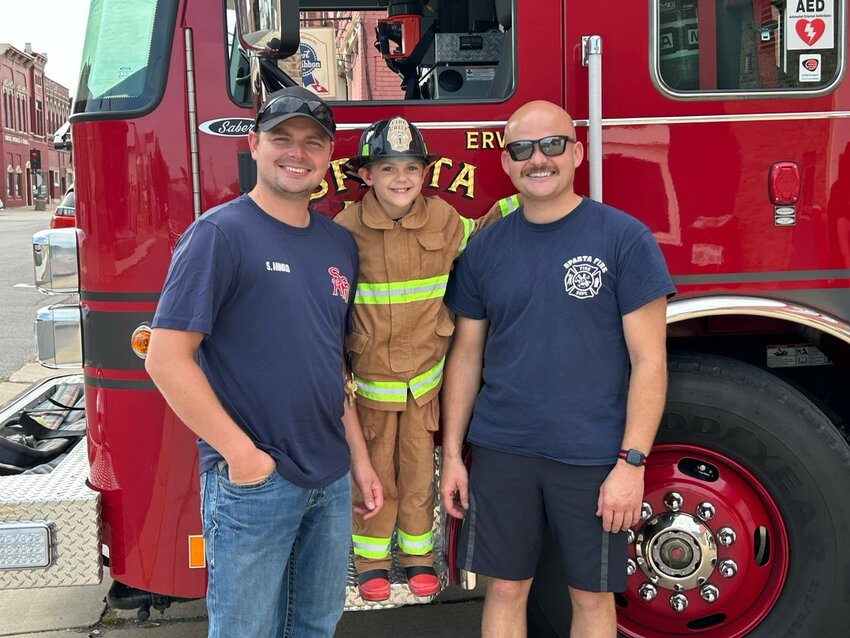 Jenna Severson captured this beaming moment after Steve and Robert Arnold, brothers and firefighters, made one of little Chief’s “wildest dreams come true” with a special ride in a fire truck.