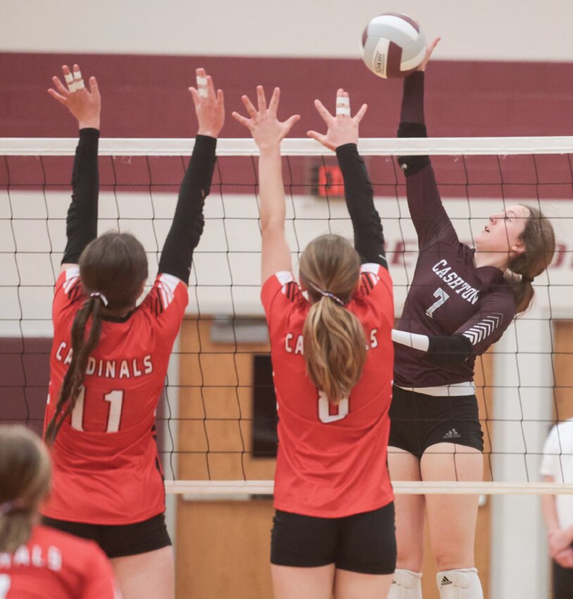 Cashton’s Vivian Dempsey connects with an attack as the
Necedah defense tries to establish a double block during
the opening set of Tuesday’s match.