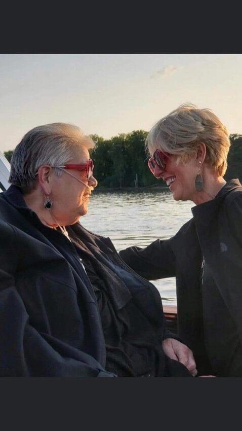 On the left we have Paula Hase-Mickelson, with her sister, Amy Weissenberger, on the right. Paula was very dear to her sister Amy. A few days before she passed, Paula enjoyed one last boat ride on the water with Amy and other family members. Amy Weissenberger is hosting a new fundraiser, with her family, that will raise money to help support single moms on their journey to become nurses. The fundraiser was created by Amy and her family in loving memory of the late Paula Hase-Mickelson, who became a nurse thanks to hard work, dedication, and financial support.